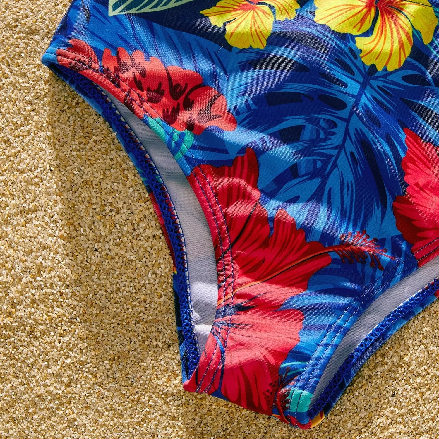 Family Matching Solid Scallop Trim Strappy Two-piece Swimsuit and Allover Floral Print Swim Trunks Shorts