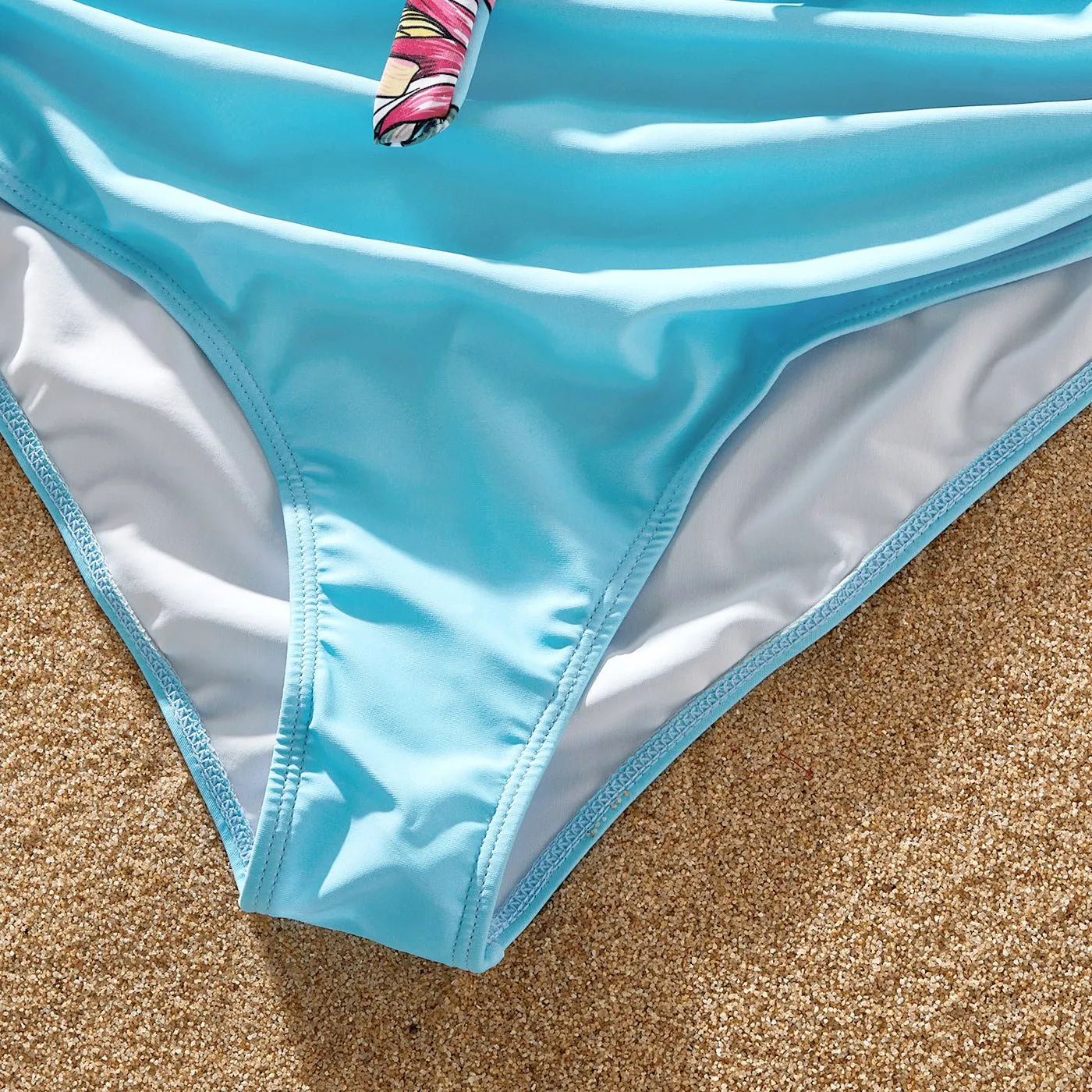 Family Matching Solid Scallop Trim Strappy Two-piece Swimsuit and Allover Floral Print Swim Trunks Shorts